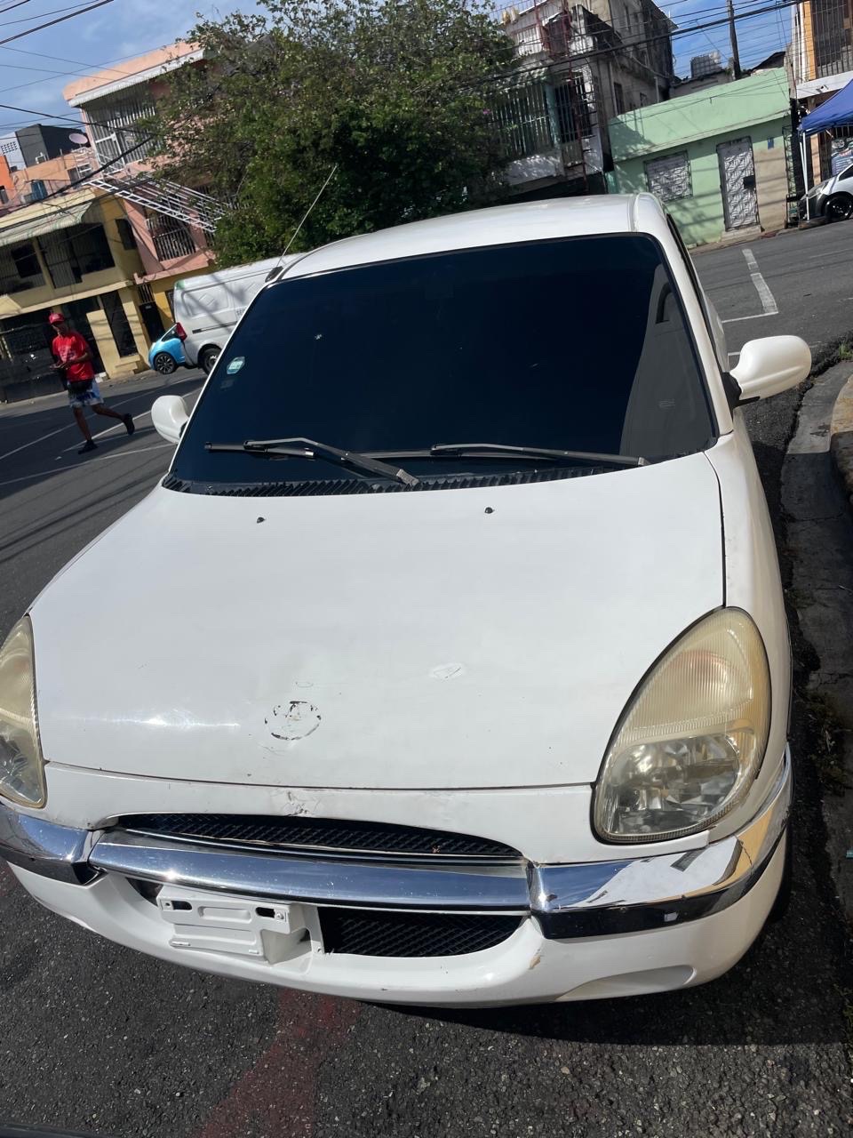 carros - Toyota duet 2003  0