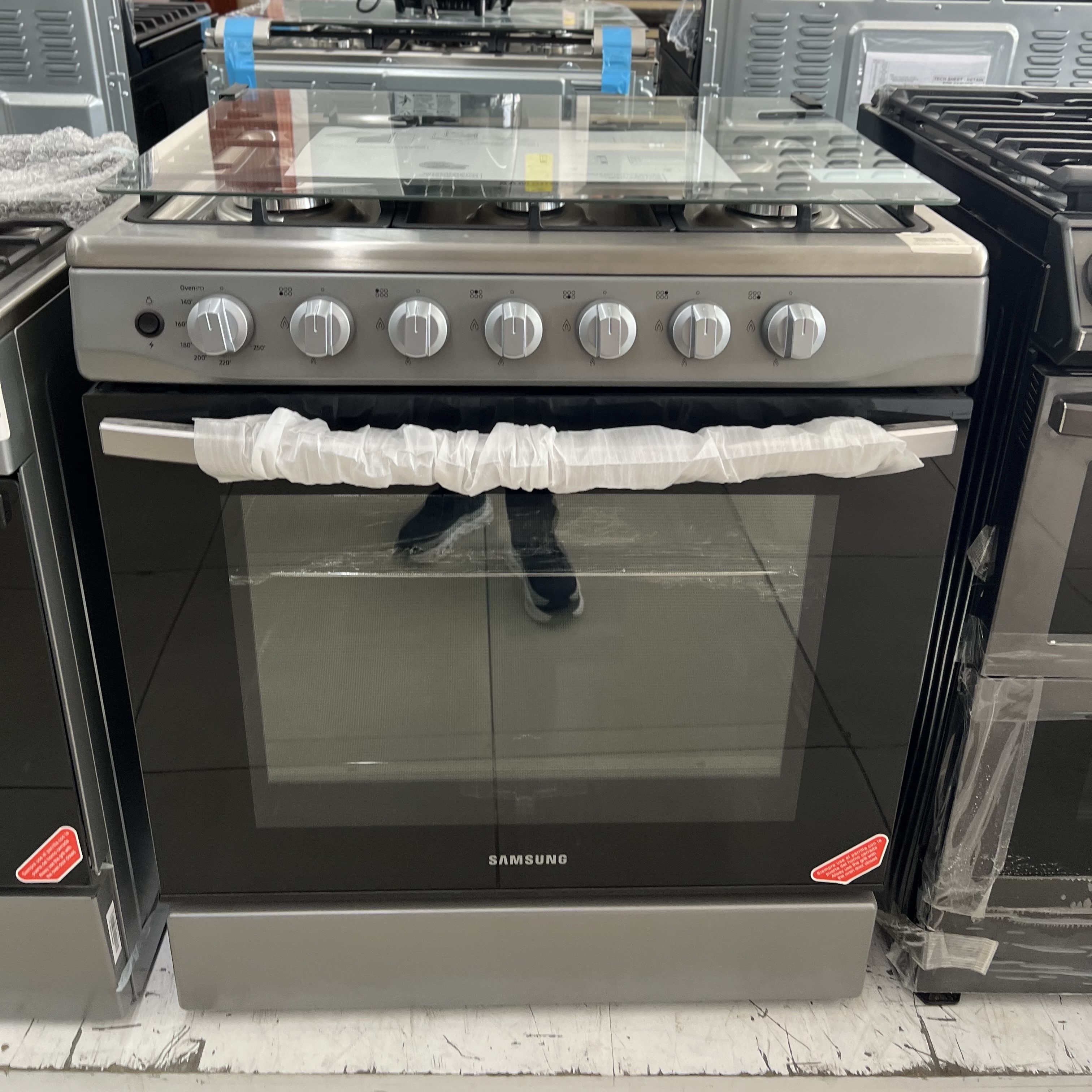 electrodomesticos - estufa Samsung 6 hornillas con luz horno  parrilla reforzada acero inoxidable  0
