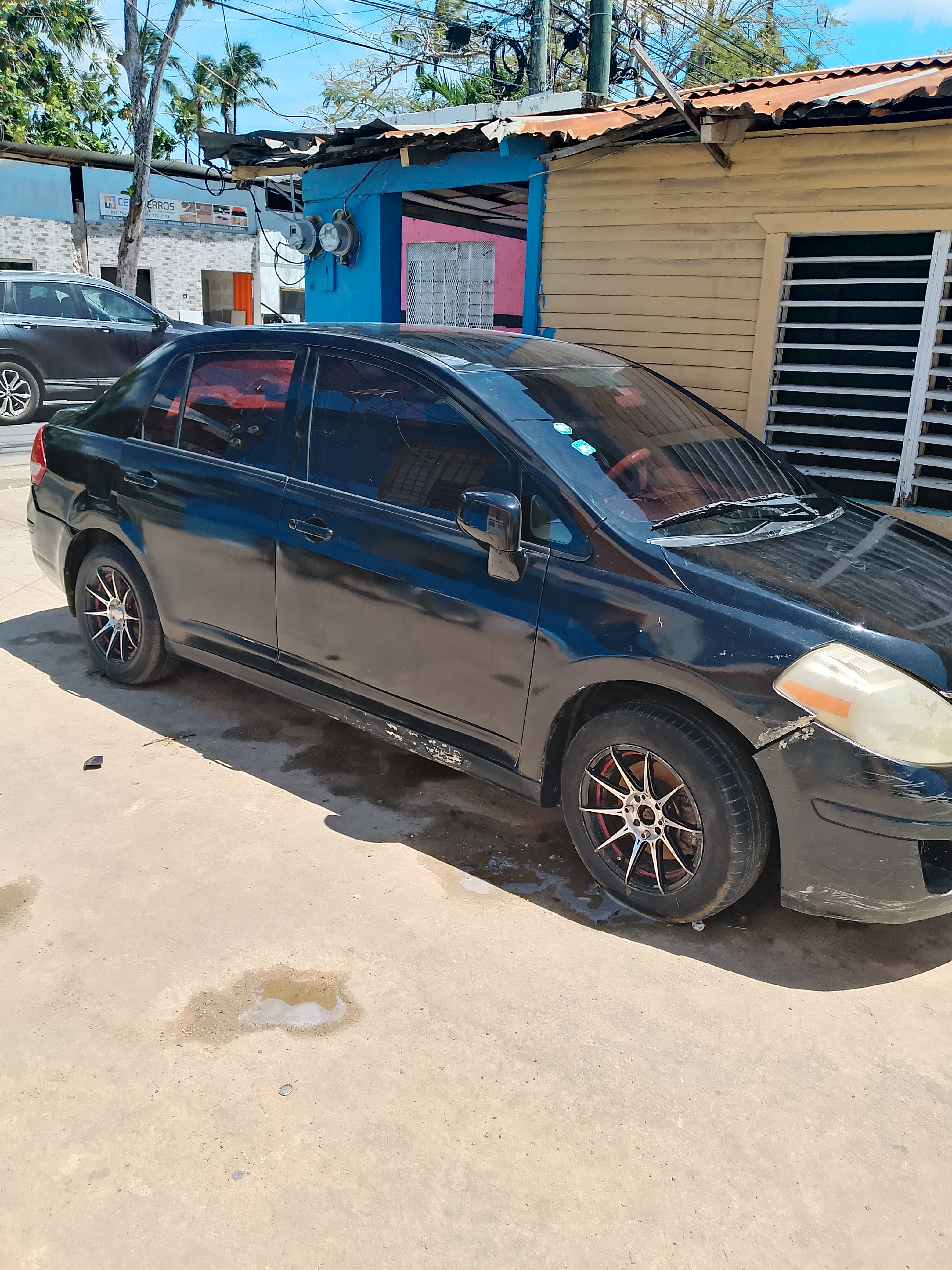 carros - Nissan versa 2009 0