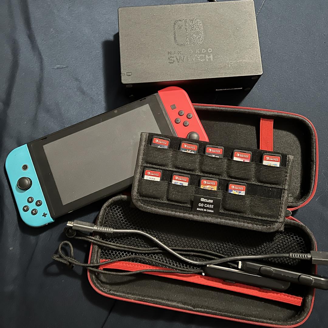 consolas y videojuegos - Paquete de Nintendo switch consola y nueve juegos, en perfecto funcionamiento!! 0